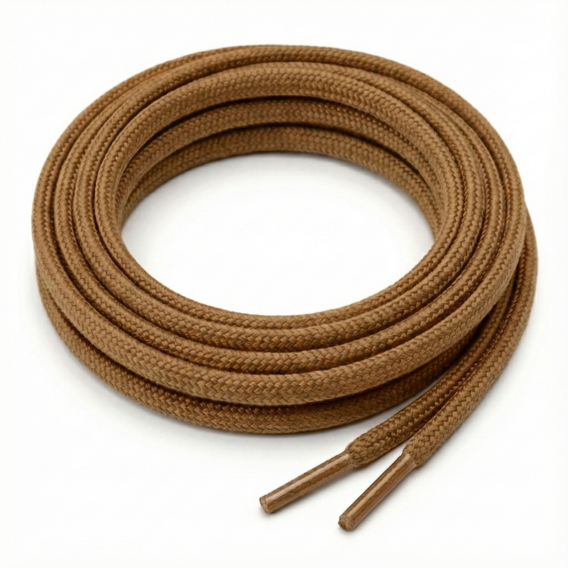 Brown shoelaces on a white background Color: Coyote Tan